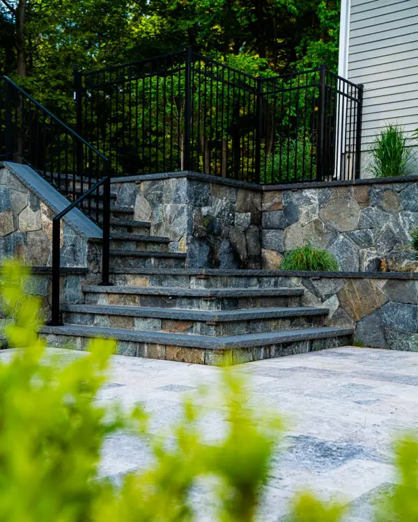 Photo of a natural stones steps with a dark granite treads