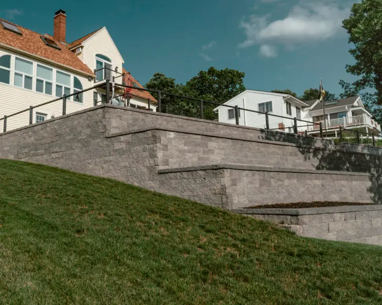 a backyard with a huge retaining wall