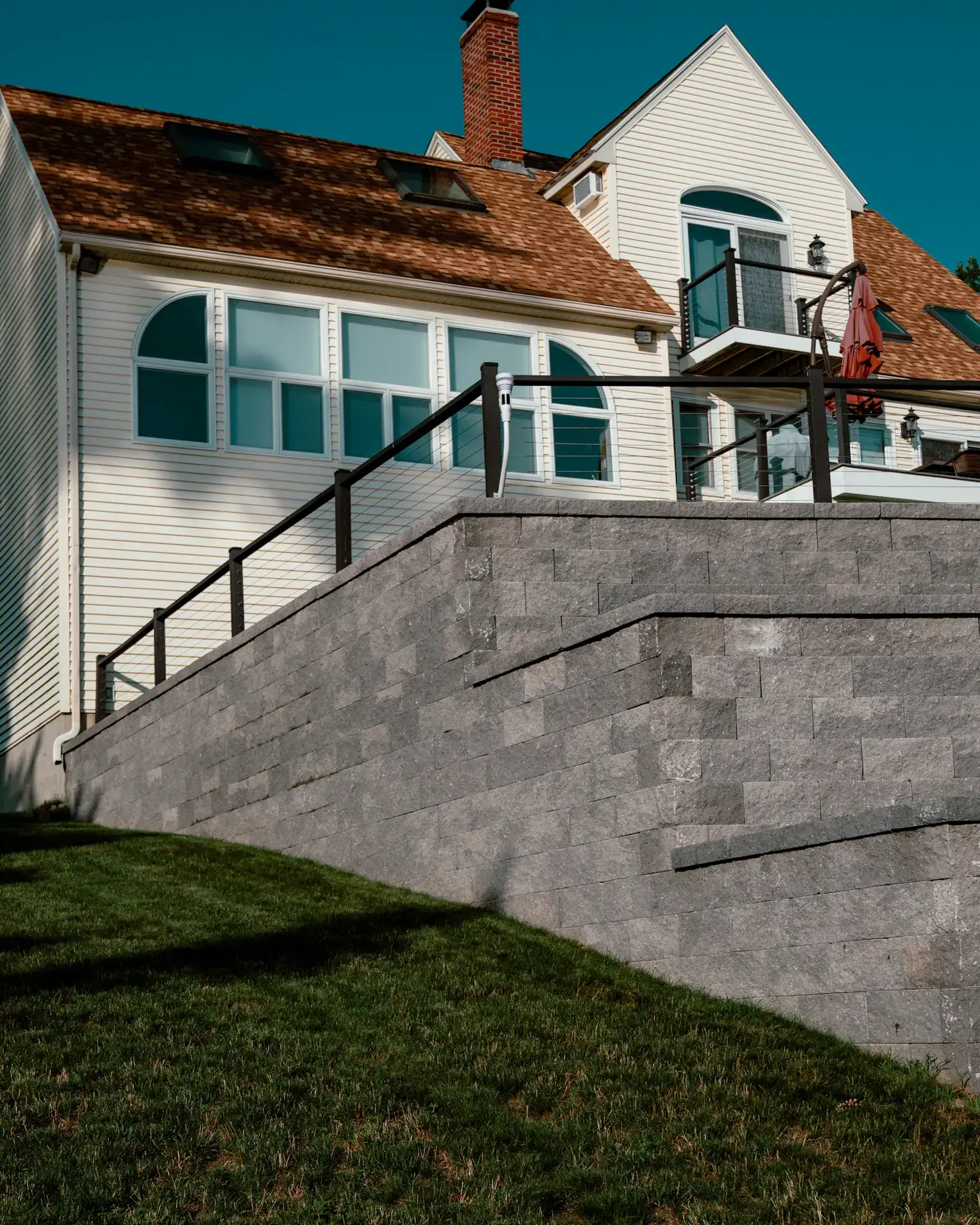 A house with a massive retaining wall on the front