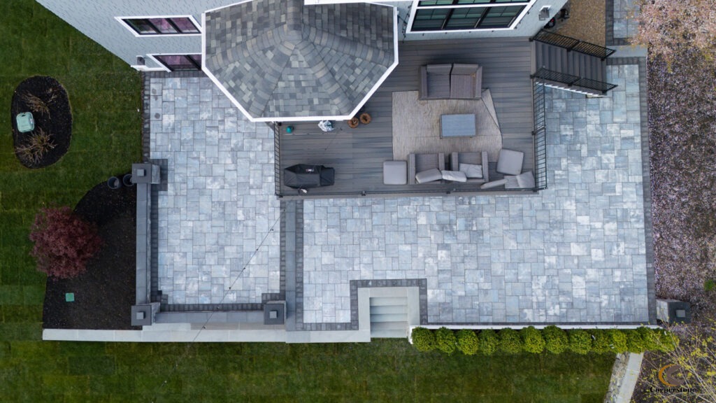 Aerial footage of a backyard patio with Cambridge pavers
