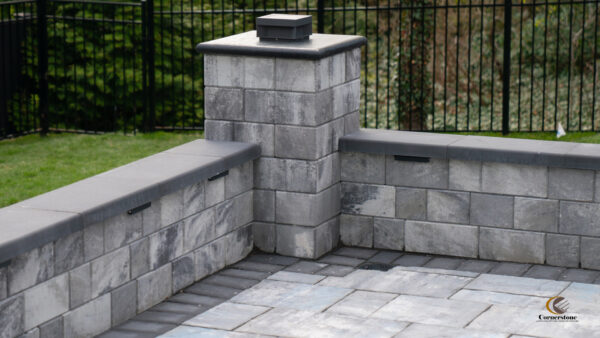 Photo of a seating wall with a pillar built in the middle using Omega Smooth wall